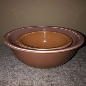 Vintage Pyrex pink mixing bowls with clear bottoms